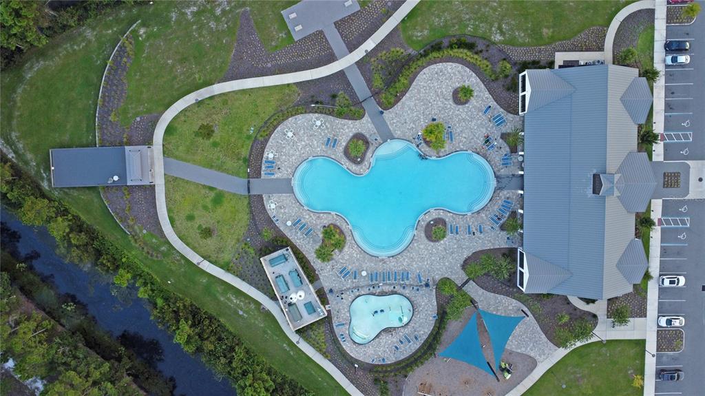 6988 Botanic Boulevard Harmony, FL 34773 - Photo 58 of 61 an aerial view of a swimming pool and outdoor space