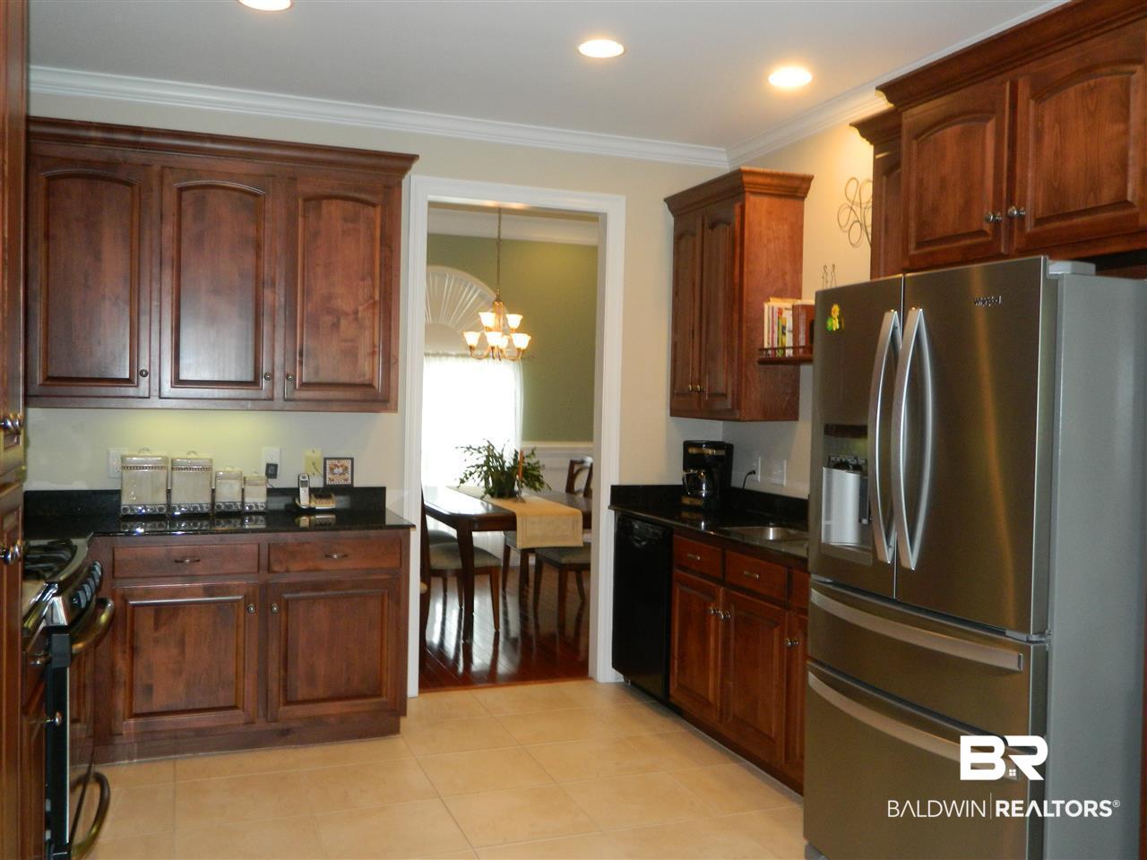 3990 Symphony Way West Semmes, AL 36575 - Photo 10 of 45 Custom cabinets, granite countertops