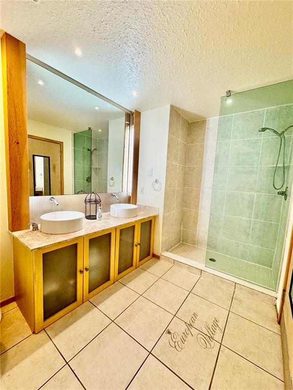 101 Palm Harbor Parkway, Unit C328 Palm Coast, FL 32137 - Photo 6 of 7 a bathroom with a sink a vanity and a mirror