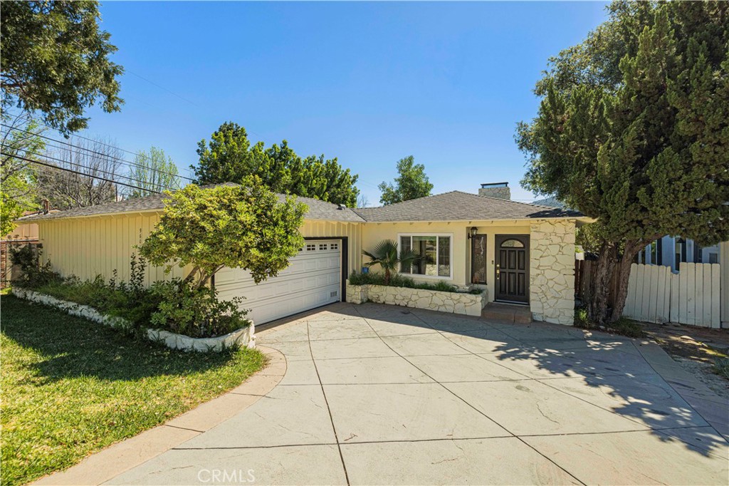 9601 Creemore Place Tujunga, CA 91042 - Photo 1 of 1 a view of house with garden space and a car parked in front of it