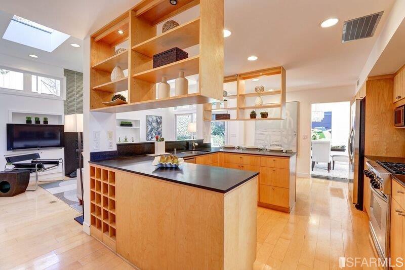 219 Ricardo Road Mill Valley, CA 94941 - Photo 12 of 31 Updated kitchen with large chefs' island including a breakfast bar.