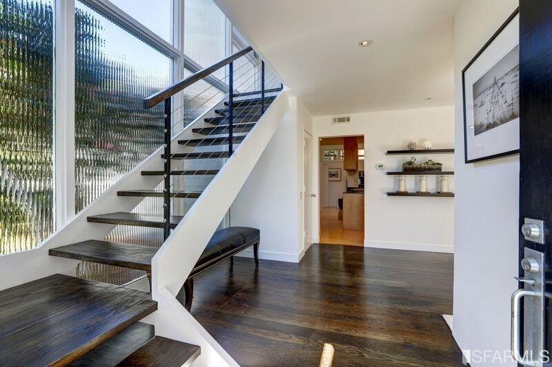 219 Ricardo Road Mill Valley, CA 94941 - Photo 4 of 31 Entrance into the main level with staircase to 2nd level and kitchen and great room in the distance.