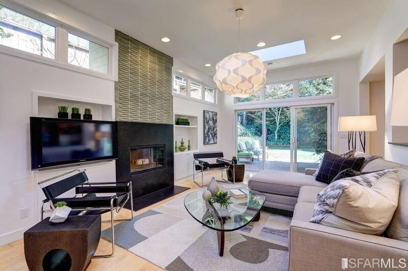 219 Ricardo Road Mill Valley, CA 94941 - Photo 9 of 31 Family/great room, with wood burning fireplace, wide screen TV (included) and access to the backyard. Recessed lighting too.