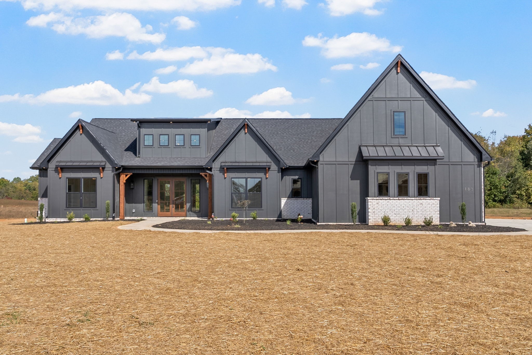 a front view of a house with a yard