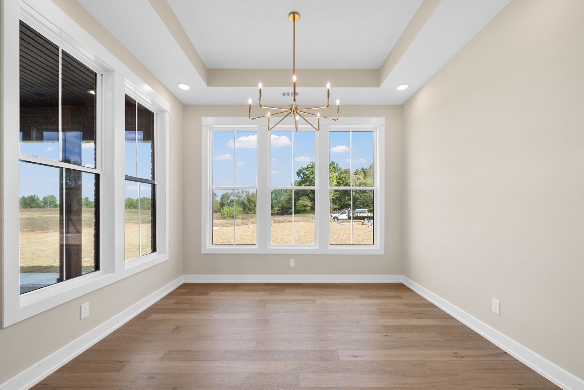3712 Budds Creek Road Palmyra, TN 37142 - Photo 11 of 100 a view of an empty room with window and chandelier fan