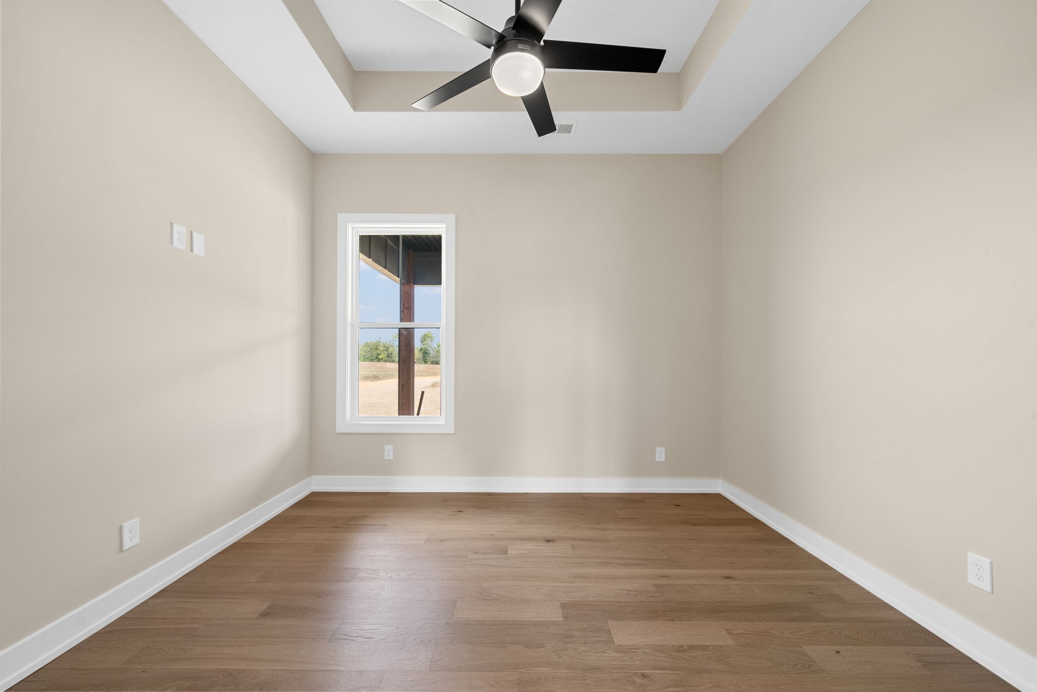 3712 Budds Creek Road Palmyra, TN 37142 - Photo 34 of 100 wooden floor in an empty room with a window