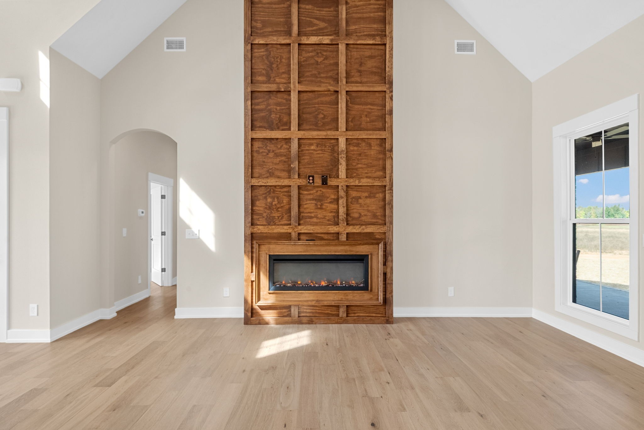 3712 Budds Creek Road Palmyra, TN 37142 - Photo 7 of 100 an empty room with a fireplace and window