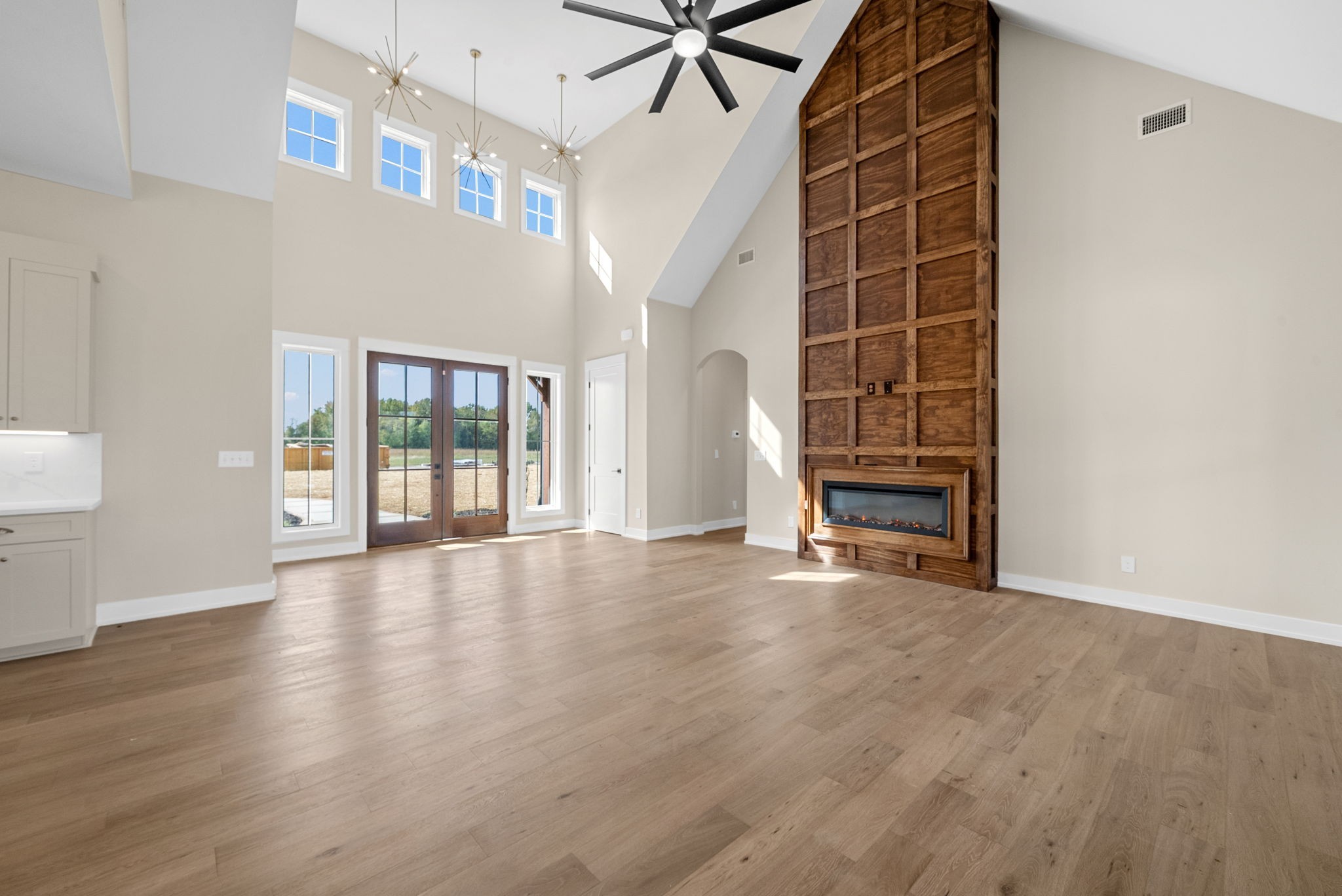 3712 Budds Creek Road Palmyra, TN 37142 - Photo 8 of 100 a view of an empty room with a fireplace and a window