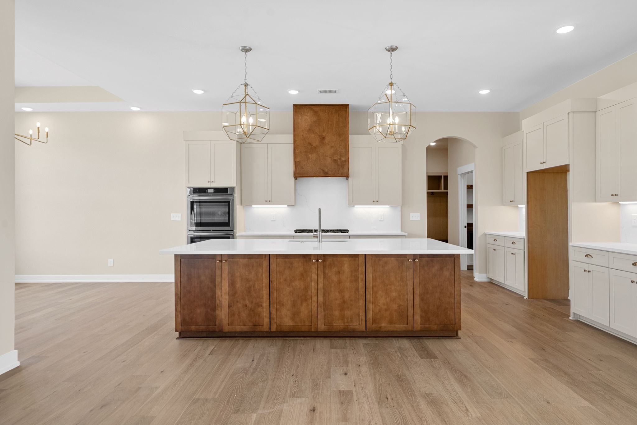 3712 Budds Creek Road Palmyra, TN 37142 - Photo 10 of 100 a large kitchen with granite countertop a large counter top space wooden floor and stainless steel appliances