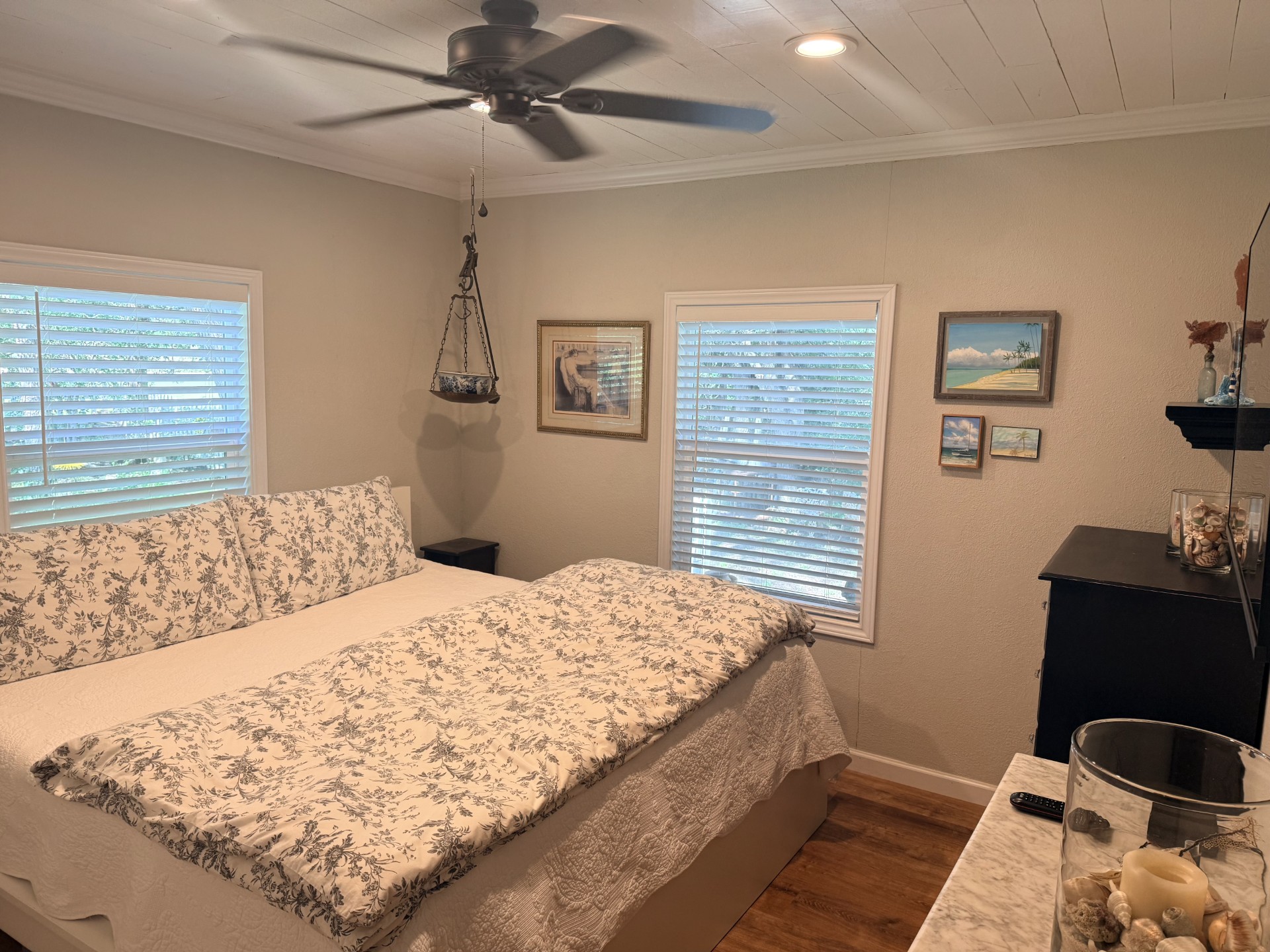 227 Crooked Hollow Road Elgin, TX 78621 - Photo 6 of 11 a bedroom with a bed and wooden floor