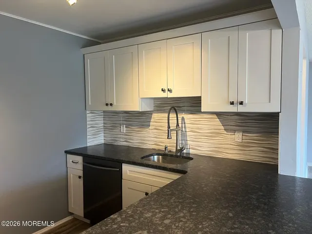 a view of kitchen with wooden floor