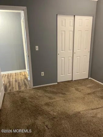 a bathroom with a double vanity sink toilet and a mirror