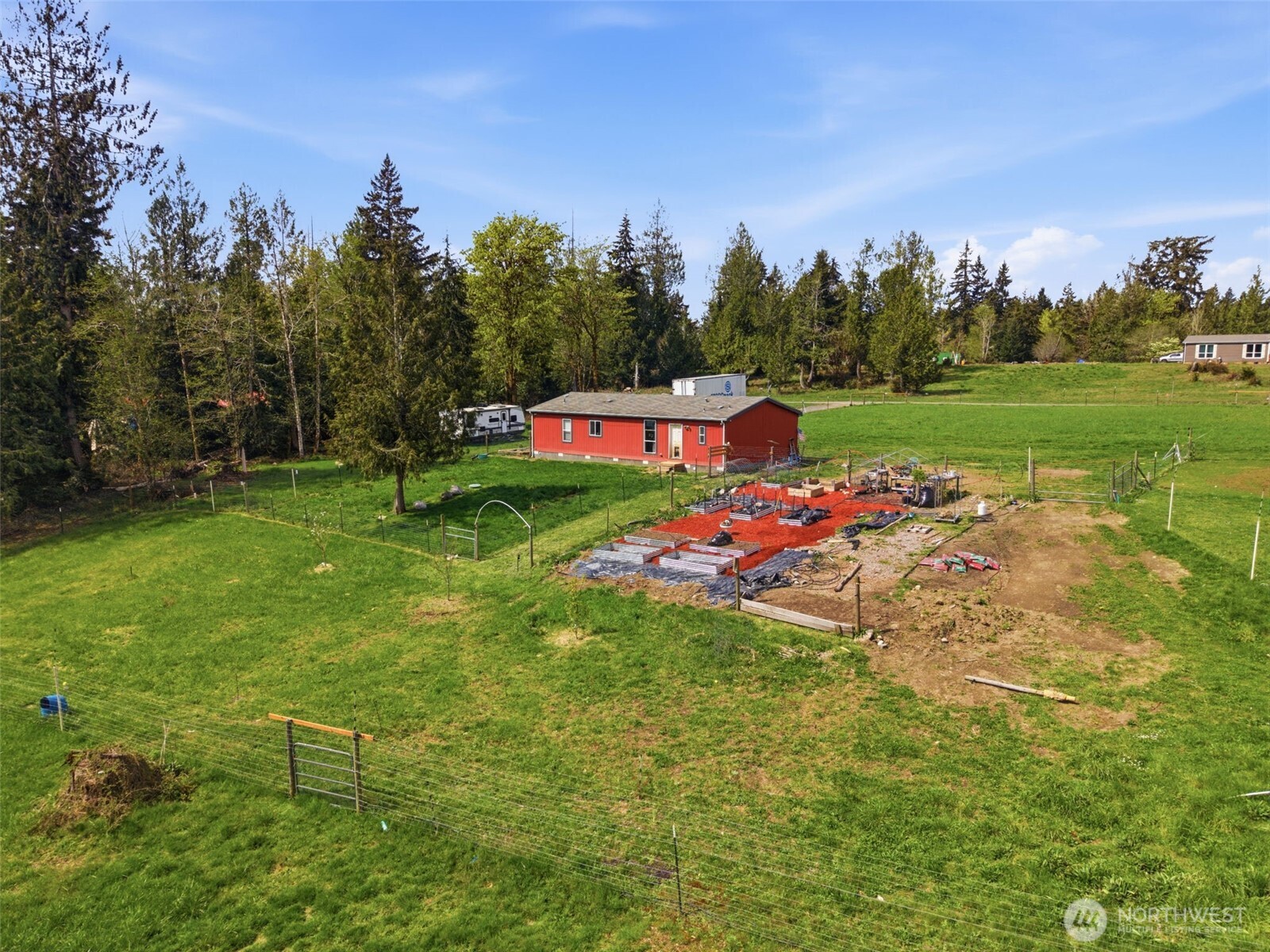 291 East Orchid Lane Grapeview, WA 98546 - Photo 1 of 37 a view of a play ground with large trees