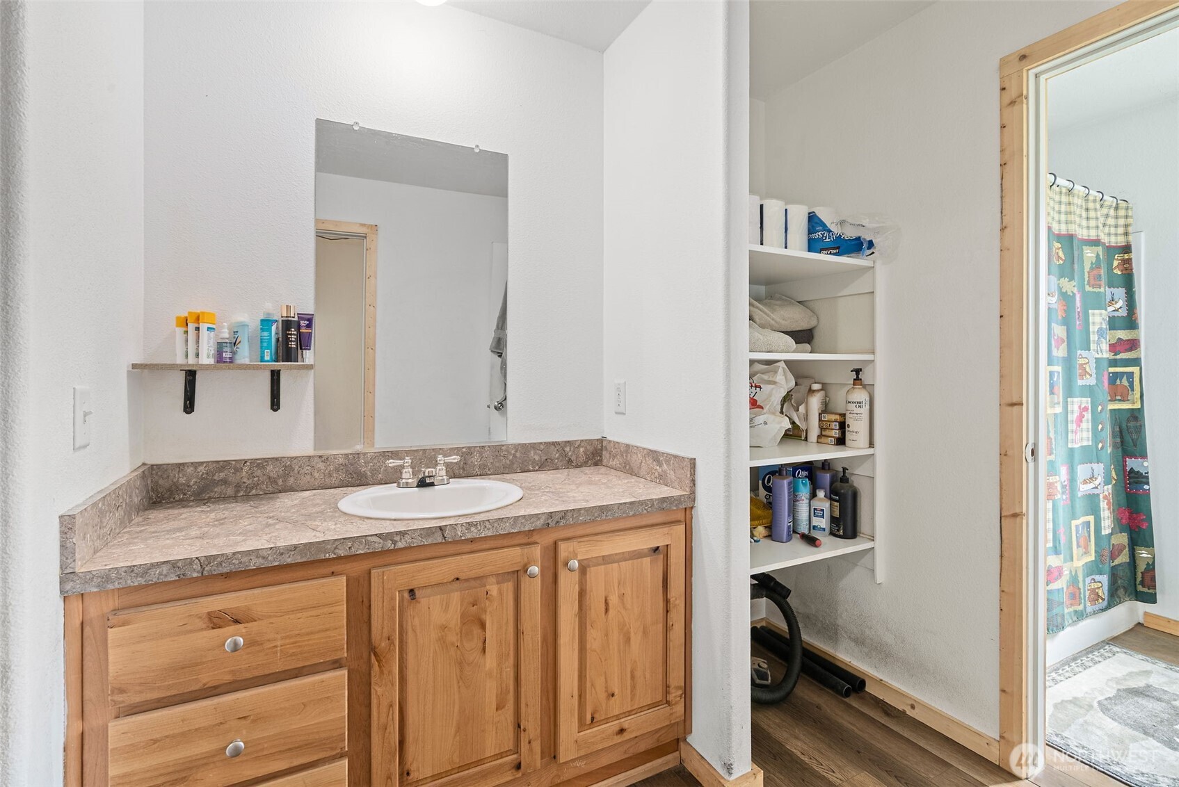 291 East Orchid Lane Grapeview, WA 98546 - Photo 11 of 37 a en suite bathroom with a granite countertop sink and a mirror