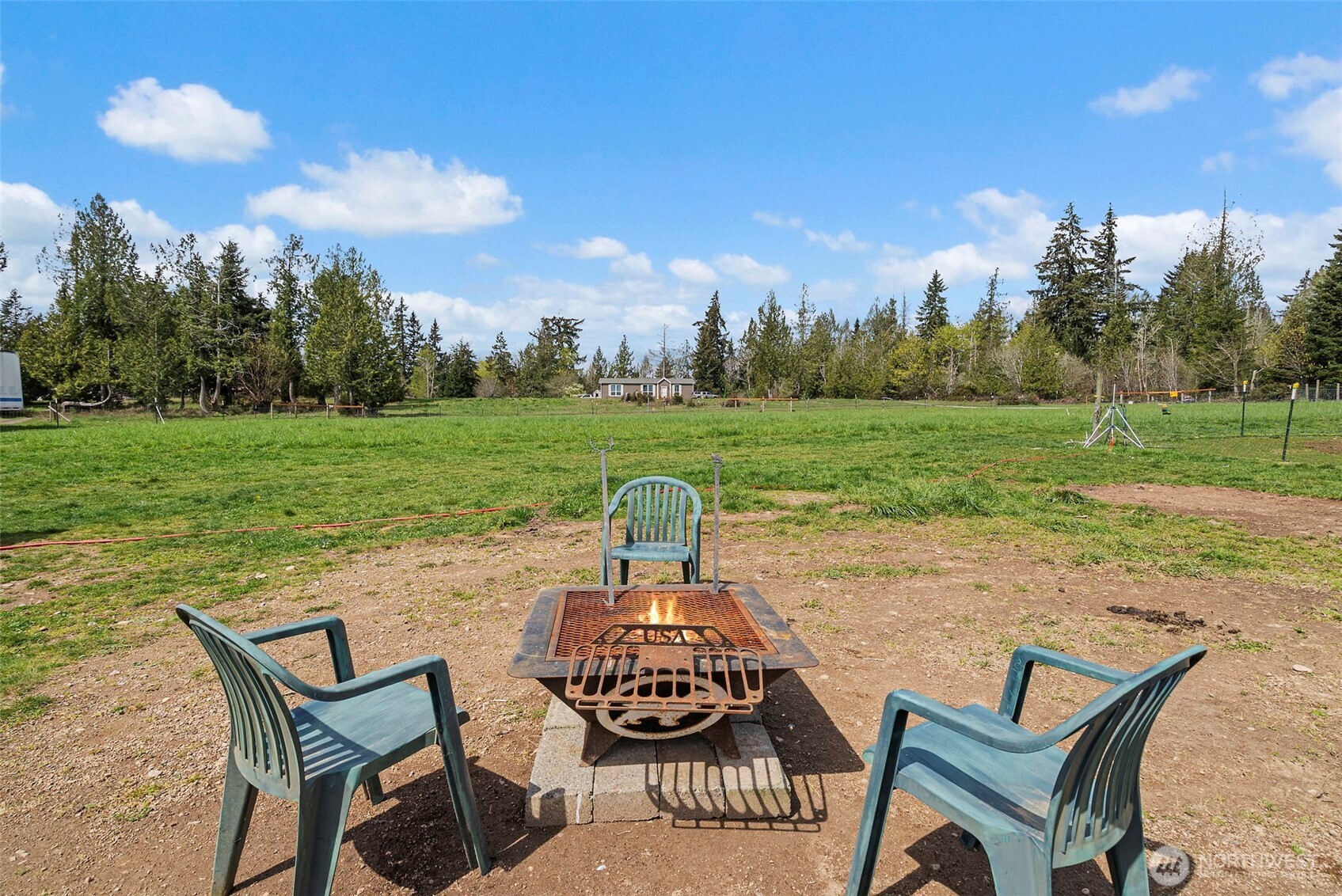 291 East Orchid Lane Grapeview, WA 98546 - Photo 19 of 37 a view of a backyard with sitting area