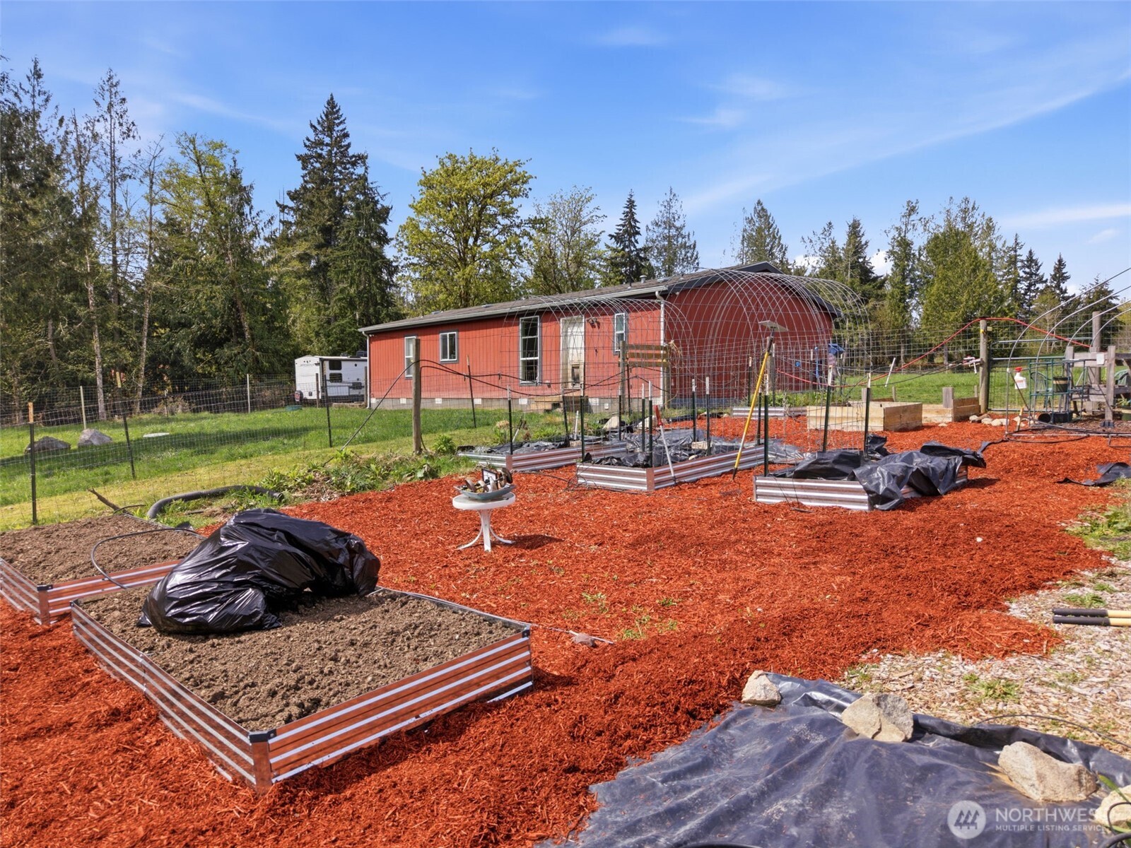 291 East Orchid Lane Grapeview, WA 98546 - Photo 22 of 37 a swimming pool with outdoor seating and yard