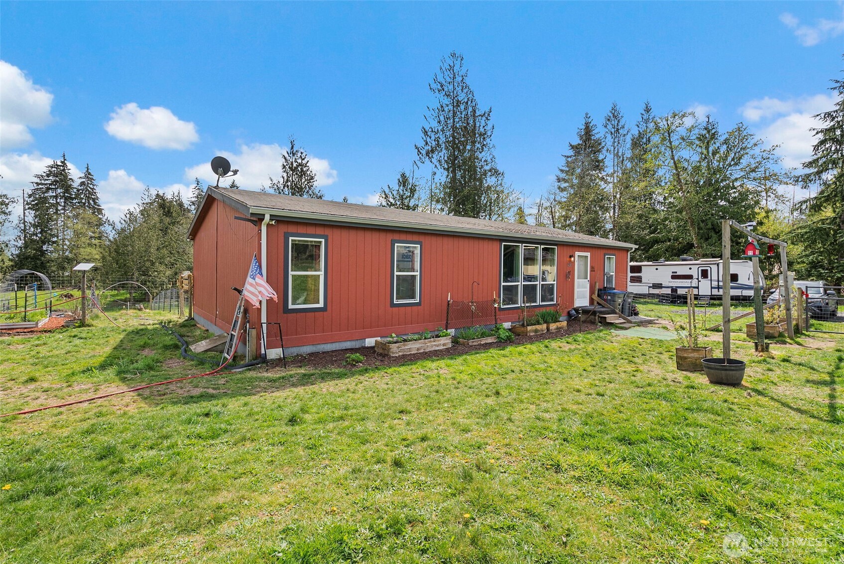 291 East Orchid Lane Grapeview, WA 98546 - Photo 3 of 37 a view of a house with backyard