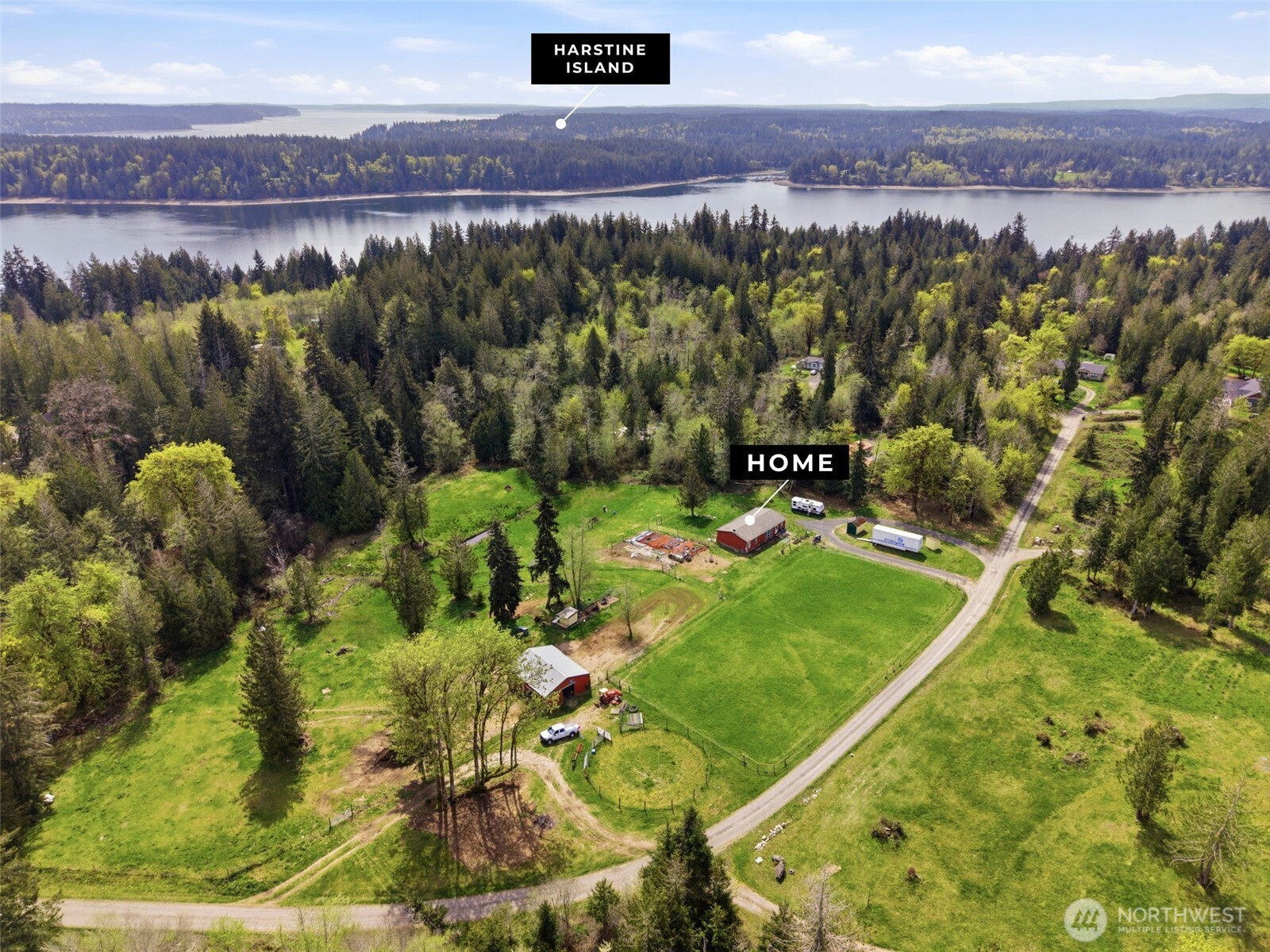 291 East Orchid Lane Grapeview, WA 98546 - Photo 34 of 37 a view of a field with an ocean