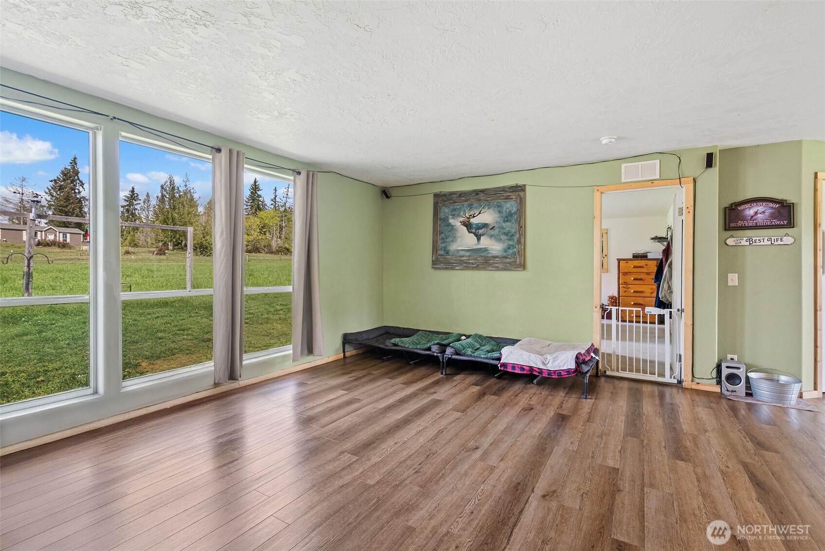 291 East Orchid Lane Grapeview, WA 98546 - Photo 6 of 37 a view of empty room with wooden floor and fan