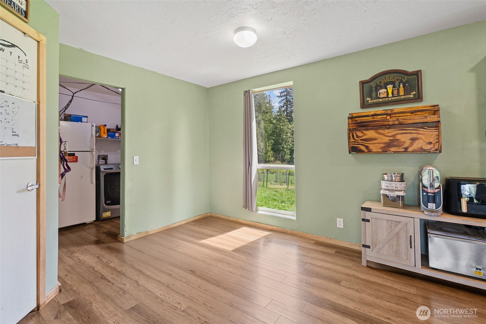291 East Orchid Lane Grapeview, WA 98546 - Photo 9 of 37 a view of kitchen with furniture and wooden floor