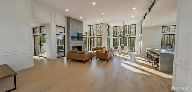 a view of living room with furniture and a wooden floor