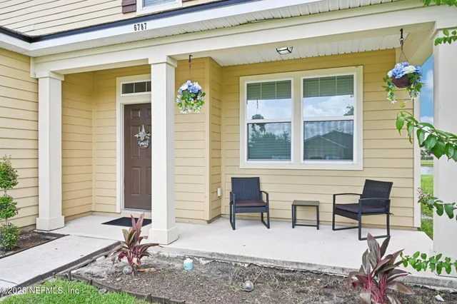 a bedroom with furniture and a chandelier