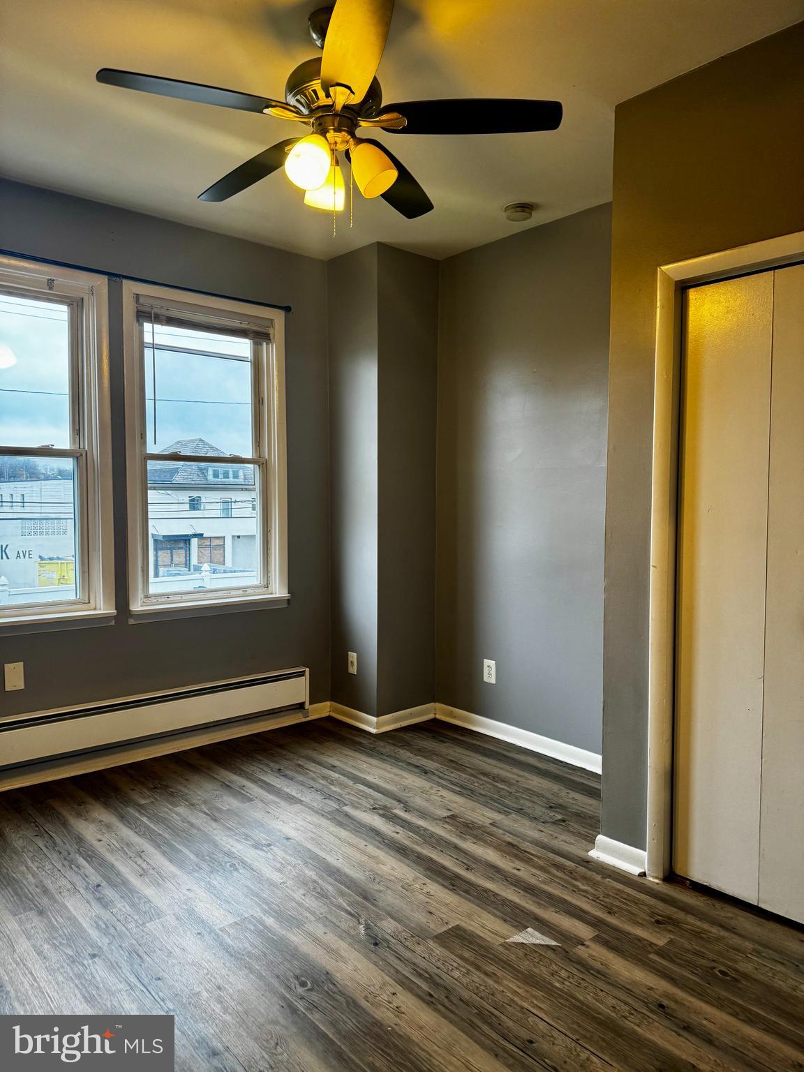 6604 O Donnell Street, Unit A Baltimore, MD 21224 - Photo 11 of 13 a view of room with window and wooden floor