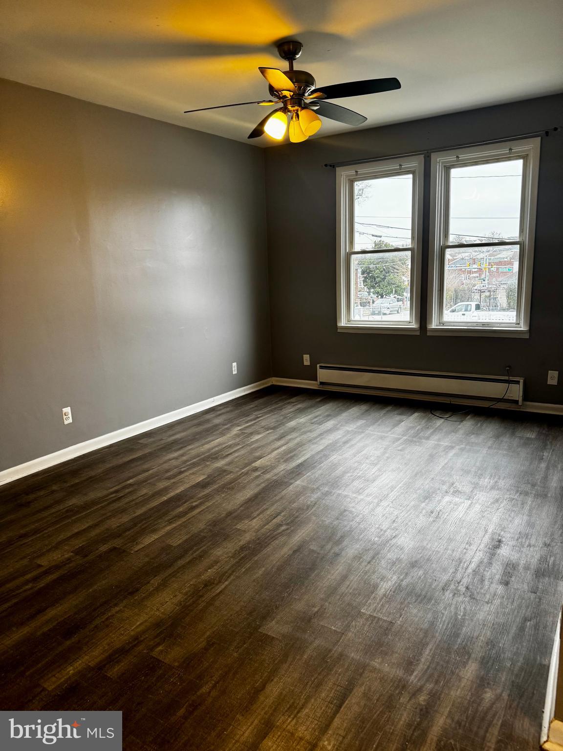 6604 O Donnell Street, Unit A Baltimore, MD 21224 - Photo 4 of 13 wooden floor in an empty room with a window