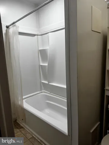 a bathroom with a sink toilet and mirror