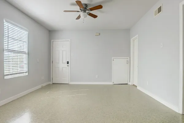 a view of an empty room with a window