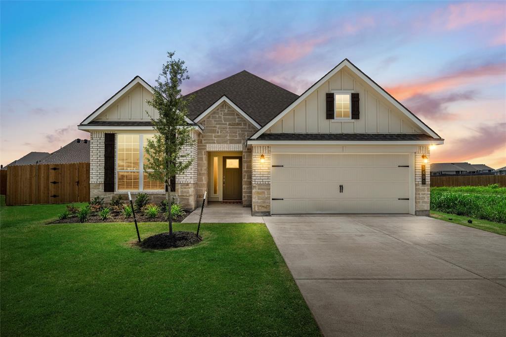 3401 Beutel Road Lorena, TX 76655 - Photo 1 of 1 a front view of a house with a yard and garage