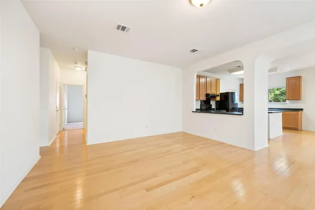 a view of a kitchen with a sink and a microwave