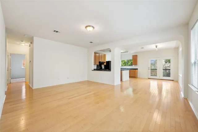 a view of a kitchen with a sink and a refrigerator
