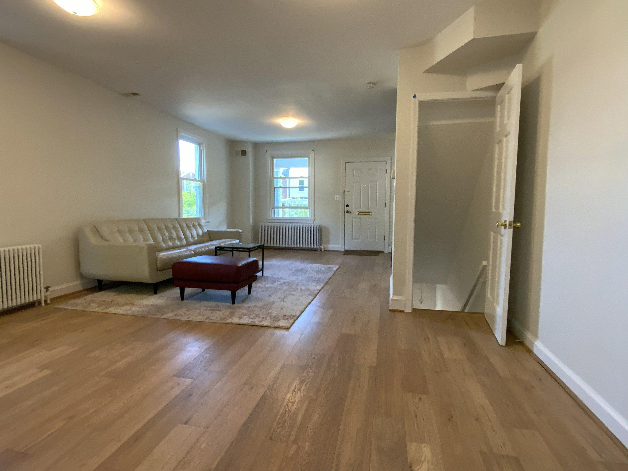 1772 E Street Northeast Washington, DC 20002 - Photo 4 of 23 a living room with furniture and a wooden floor