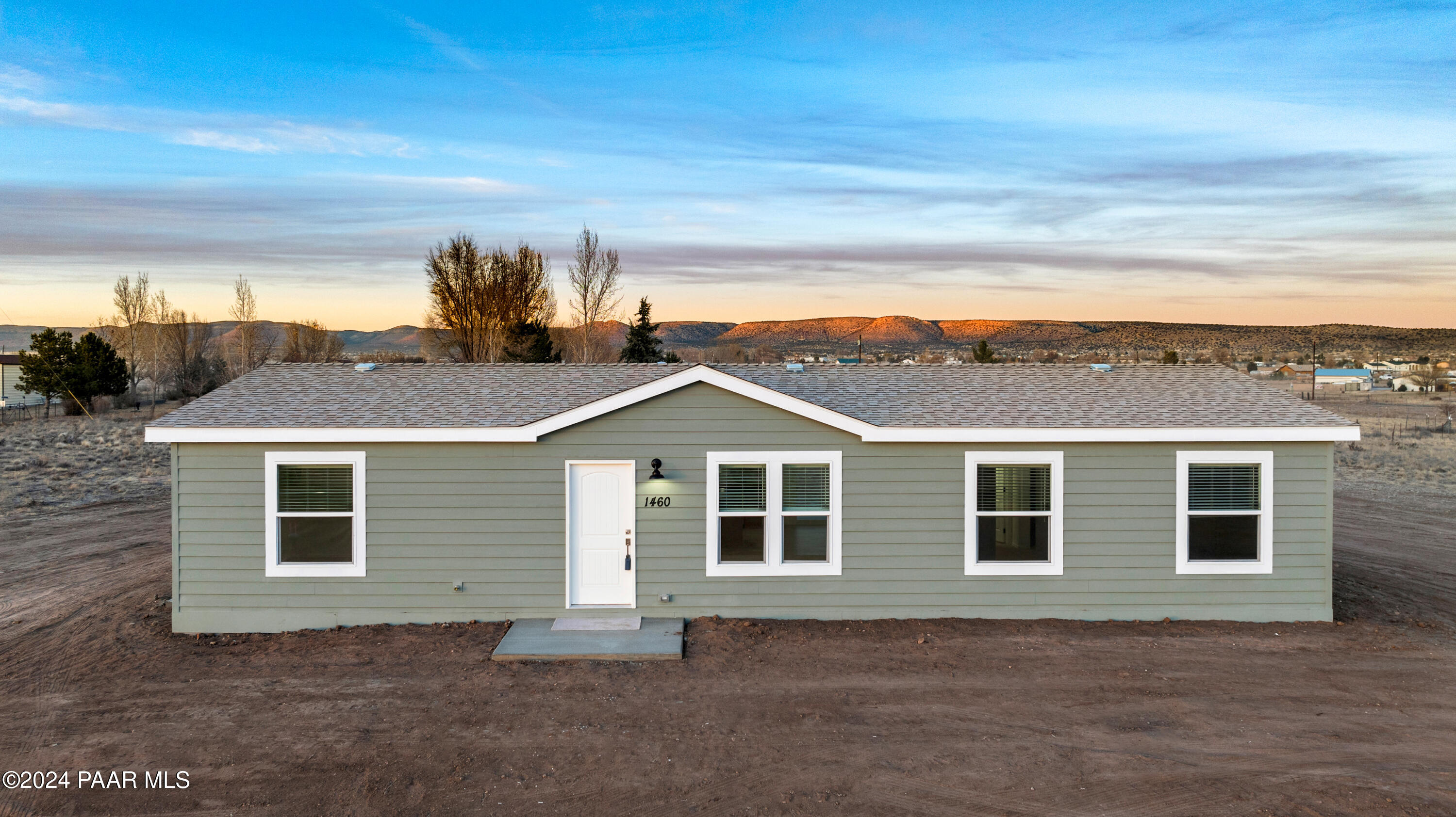 1460 Saddle Road Paulden, AZ 86334 - Photo 1 of 27 a front view of a house with a yard