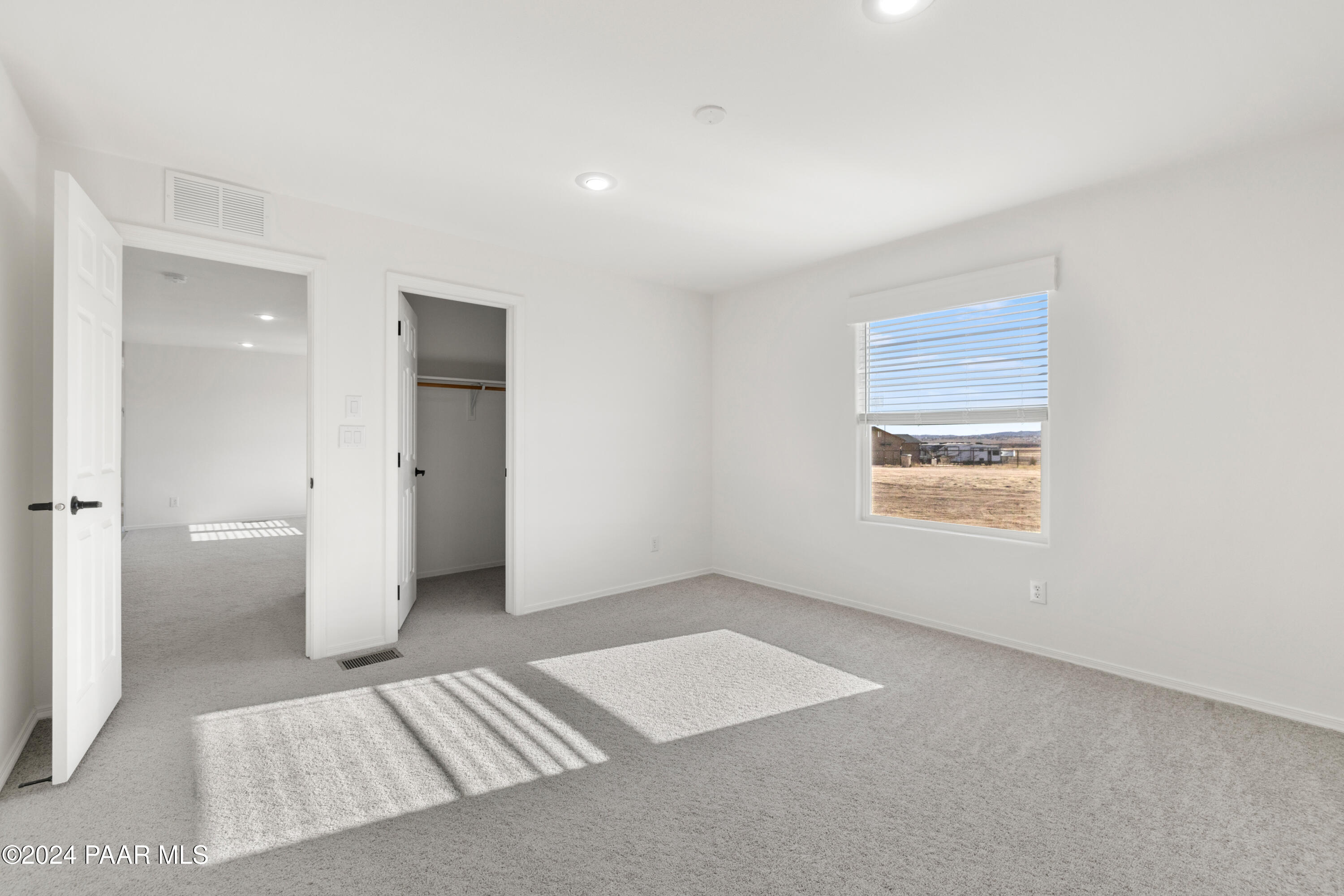 1460 Saddle Road Paulden, AZ 86334 - Photo 13 of 27 an empty room with a window and a bathroom