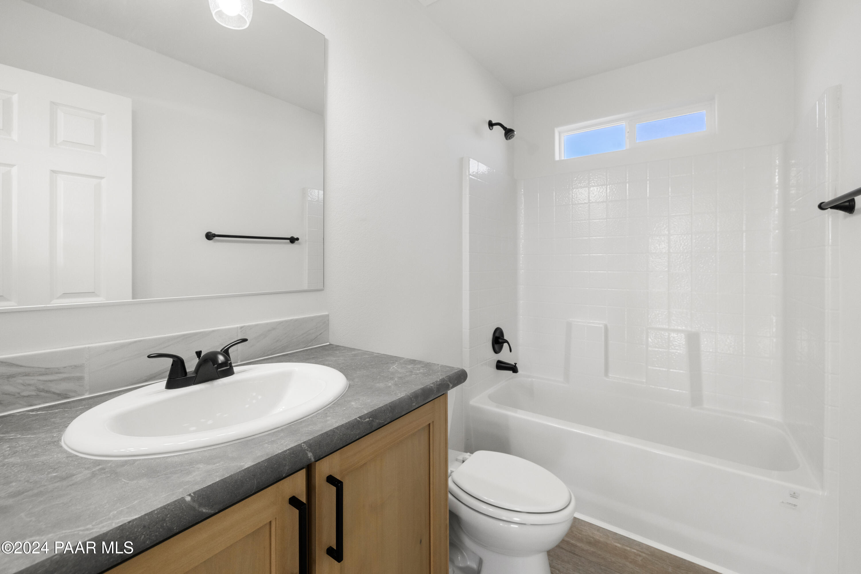 1460 Saddle Road Paulden, AZ 86334 - Photo 17 of 27 a bathroom with a sink toilet and a bathtub