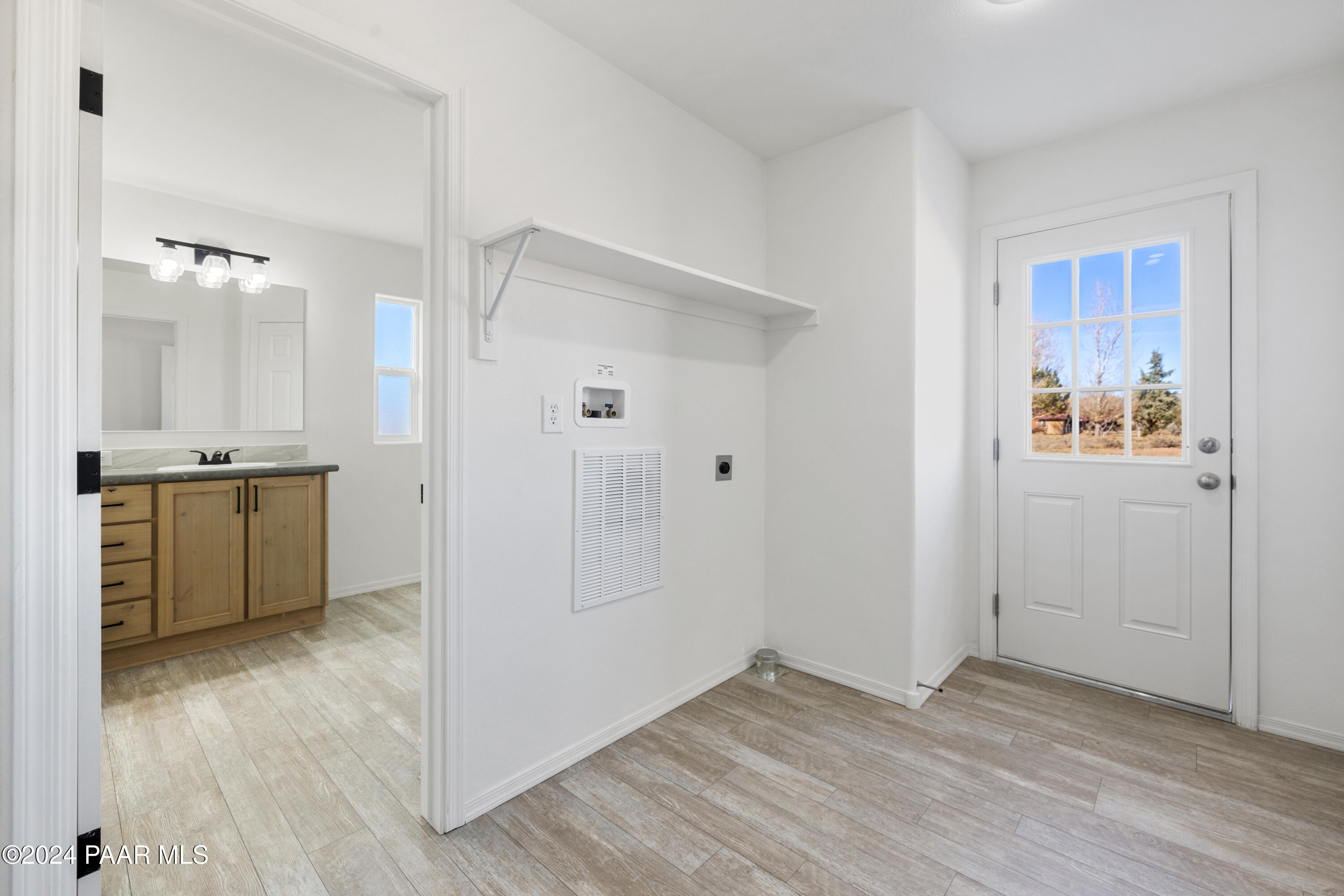 1460 Saddle Road Paulden, AZ 86334 - Photo 18 of 27 a view of a kitchen with wooden floor and a sink