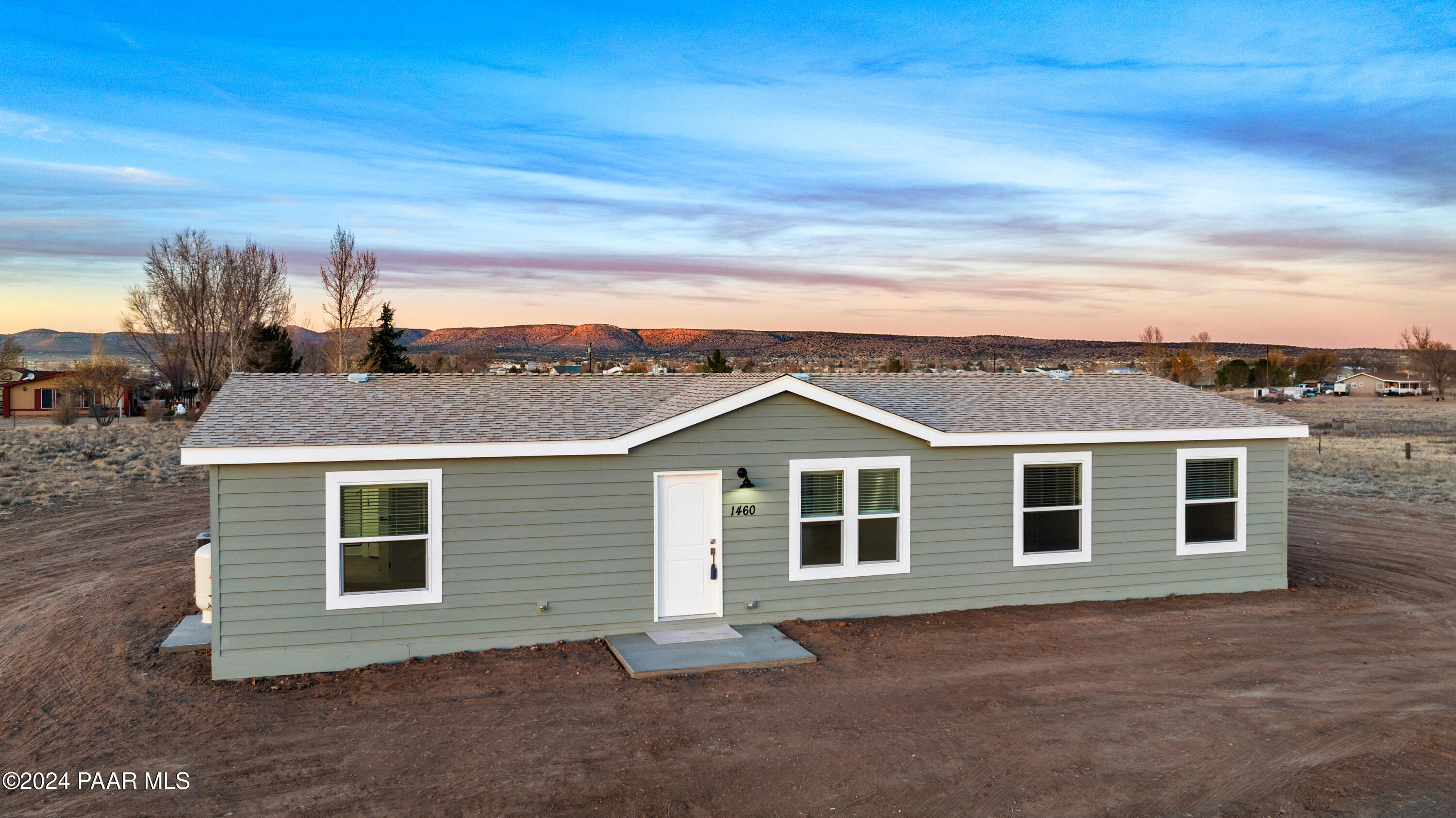 1460 Saddle Road Paulden, AZ 86334 - Photo 3 of 27 a front view of a house with a garage