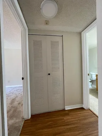 a view of entryway with wooden floor