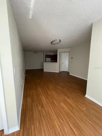 a view of a livingroom with wooden floor