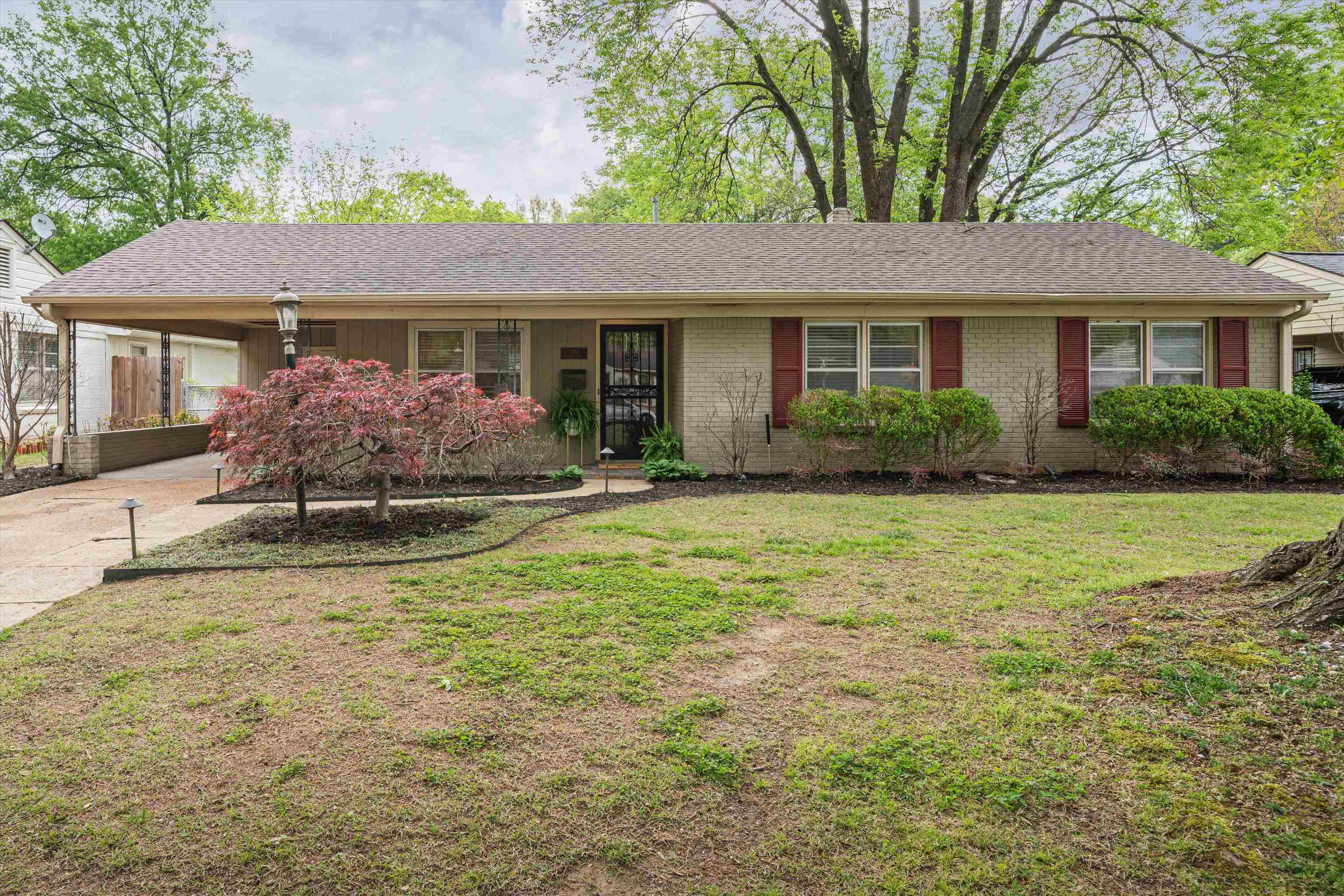 1194 West Perkins Road Memphis, TN 38117 - Photo 1 of 23 a front view of a house with garden