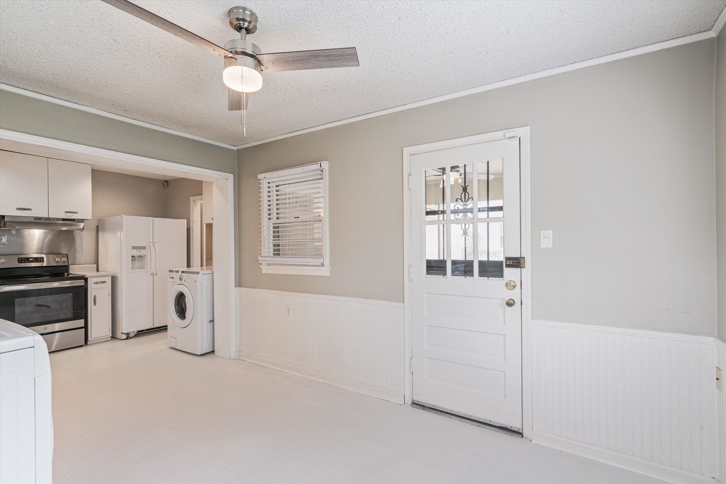 1194 West Perkins Road Memphis, TN 38117 - Photo 12 of 23 a view of a kitchen with a sink and dishwasher a refrigerator with wooden floor