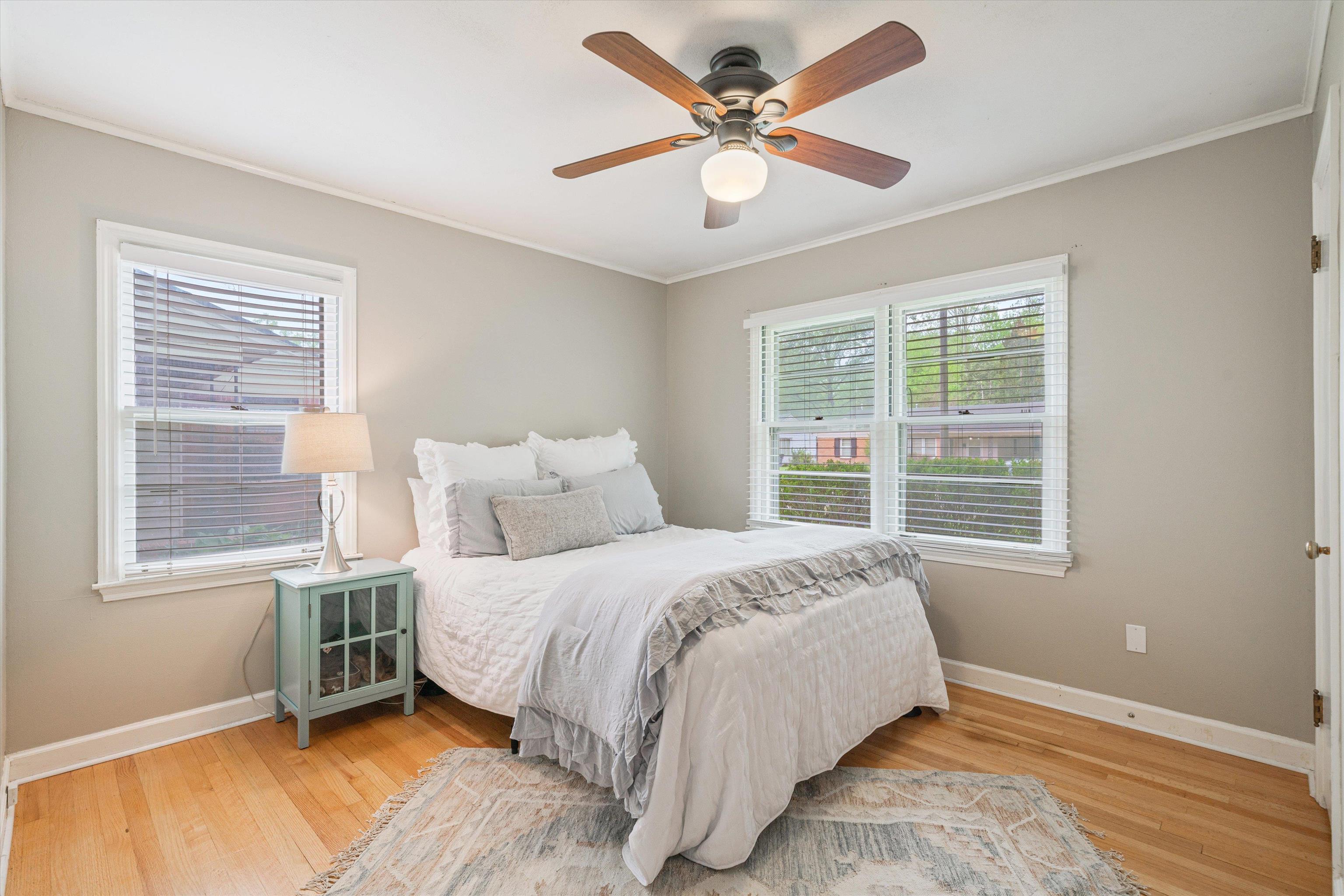 1194 West Perkins Road Memphis, TN 38117 - Photo 13 of 23 a bedroom with a large bed chandelier and a window