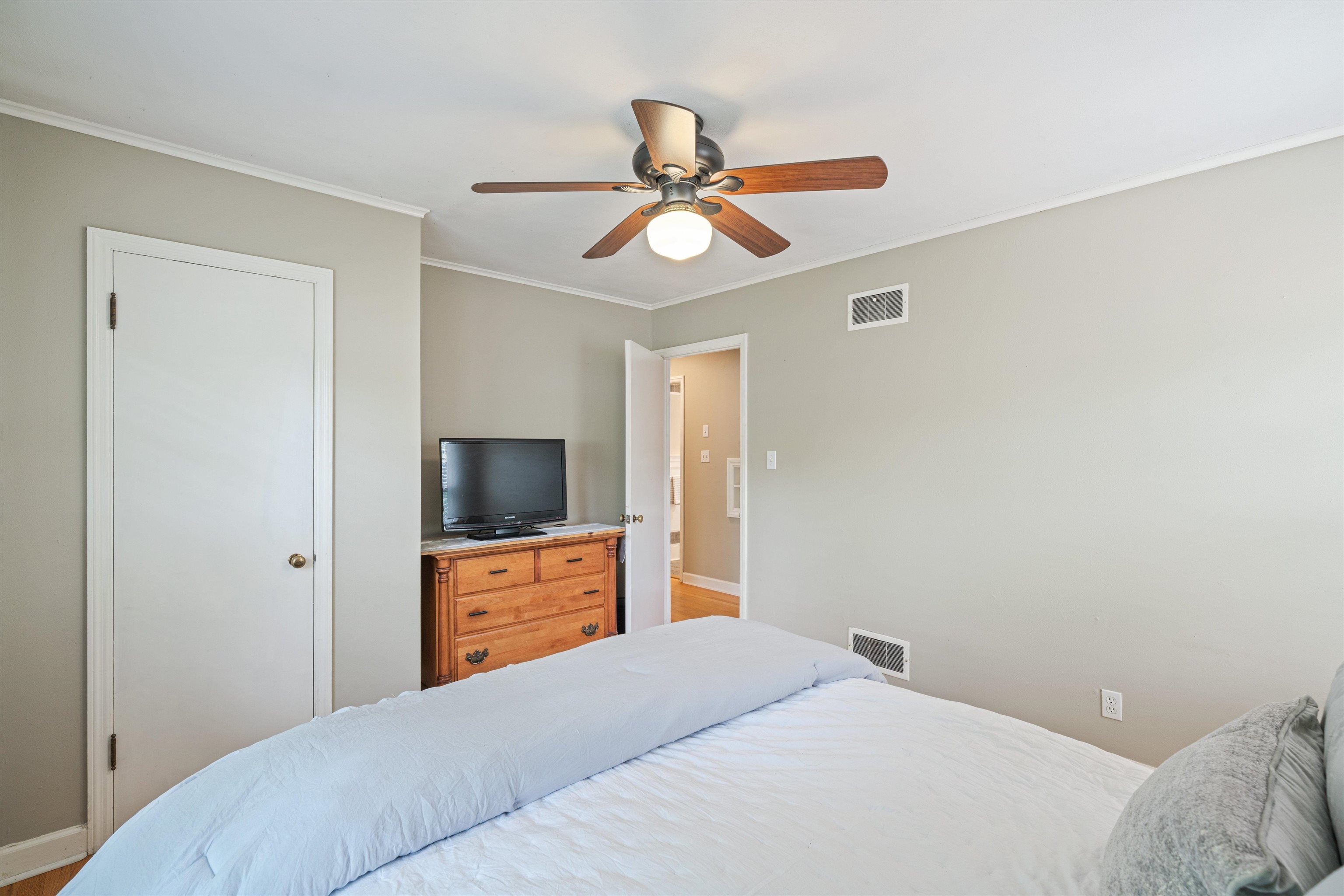 1194 West Perkins Road Memphis, TN 38117 - Photo 14 of 23 a bedroom with a bed and a chandelier