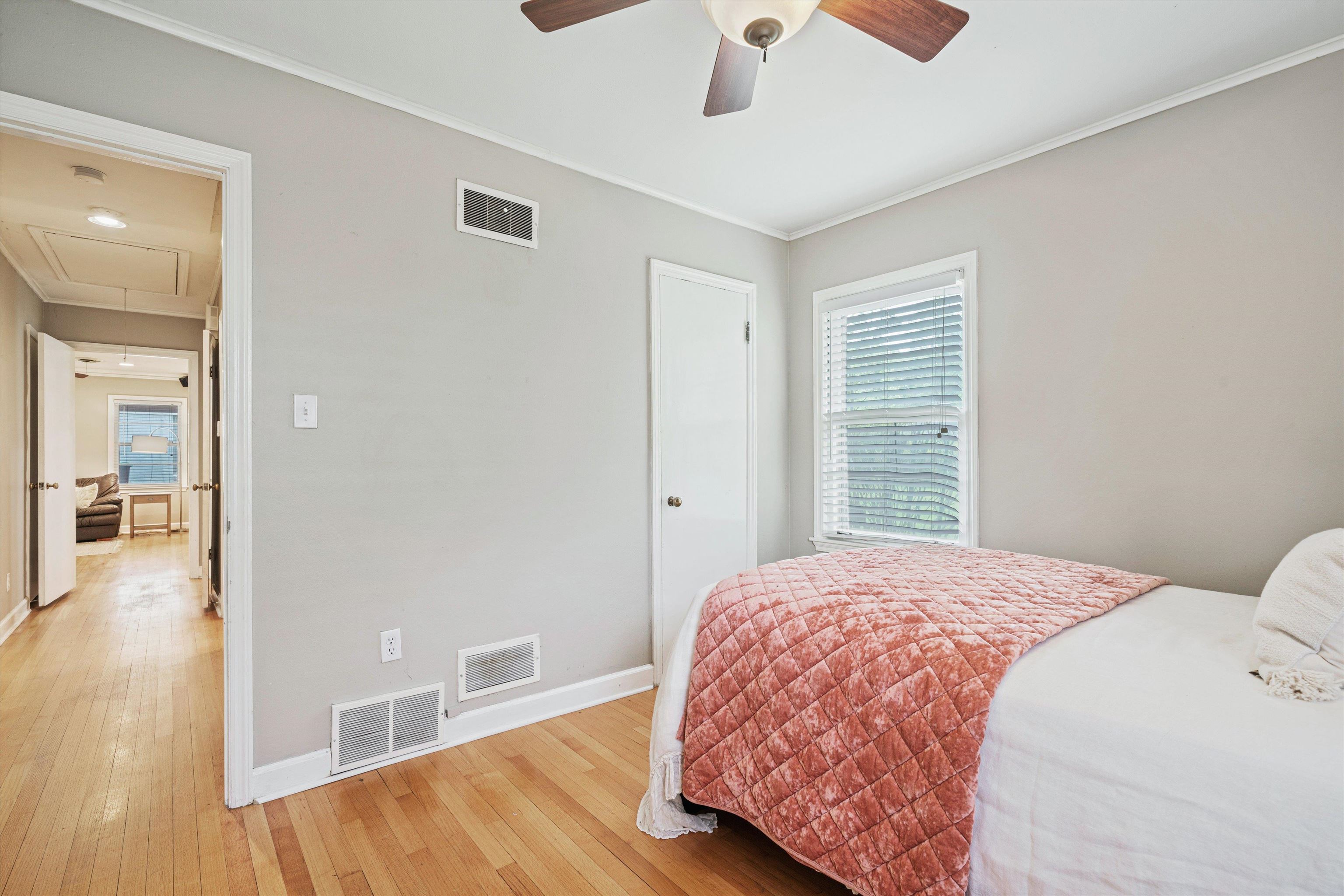 1194 West Perkins Road Memphis, TN 38117 - Photo 17 of 23 a bedroom with a bed and wooden floor