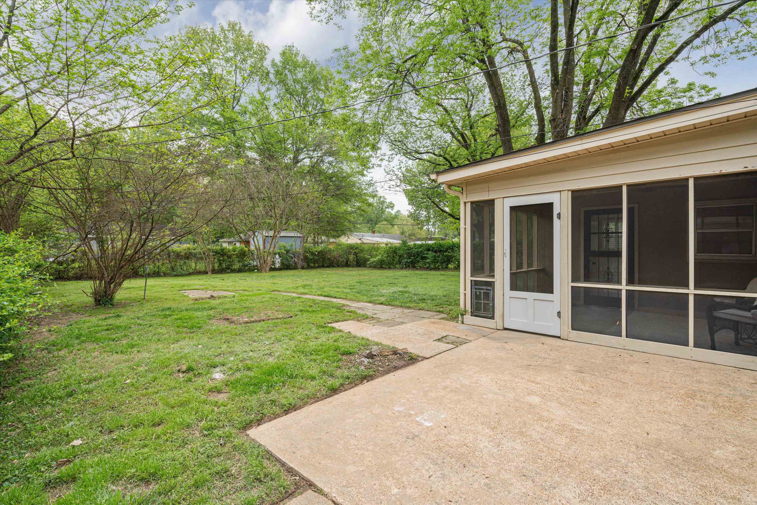 1194 West Perkins Road Memphis, TN 38117 - Photo 21 of 23 a view of a backyard with large trees