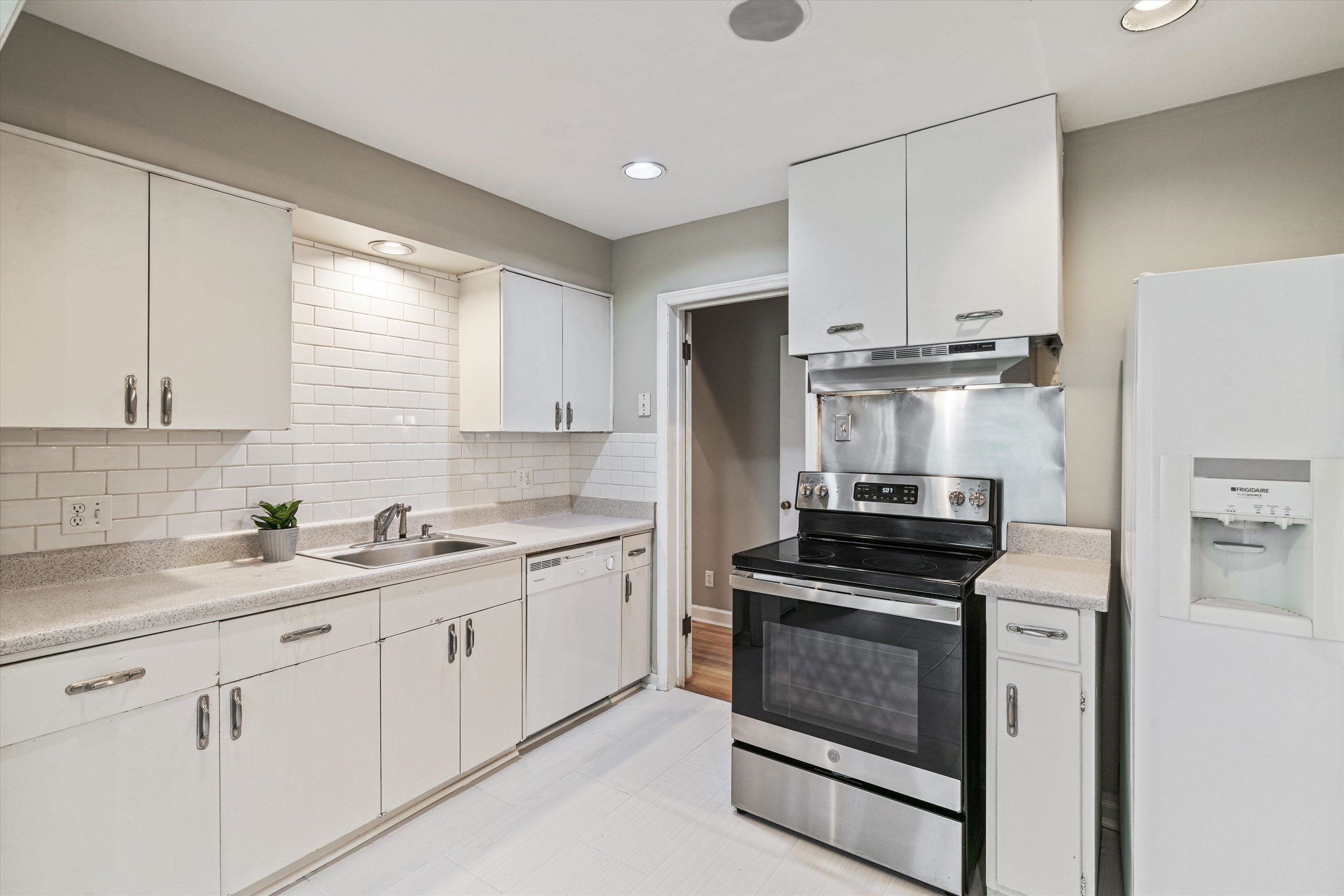 1194 West Perkins Road Memphis, TN 38117 - Photo 8 of 23 a kitchen with cabinets stainless steel appliances and sink
