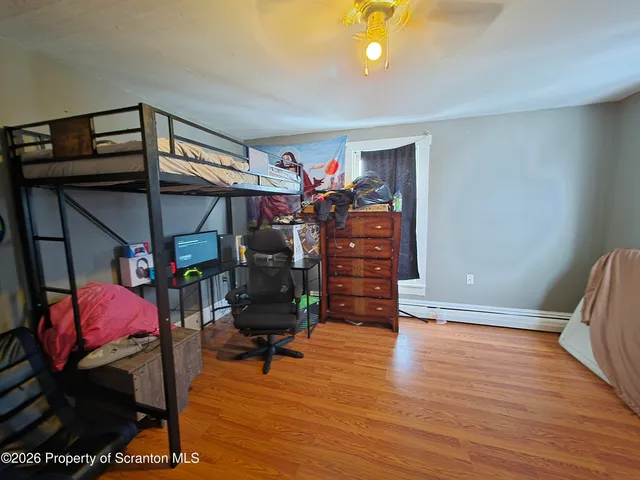 a kitchen with a refrigerator and cabinets