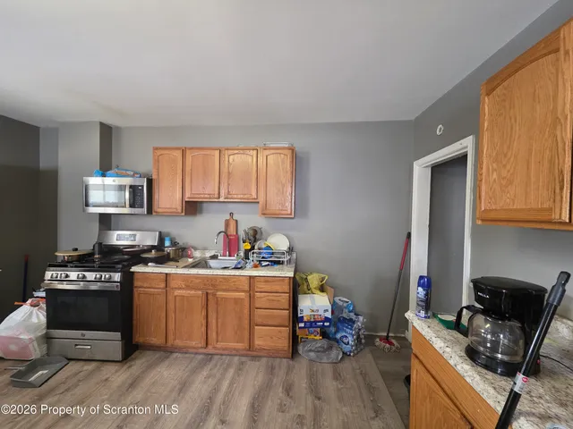a room with furniture and a flat screen tv